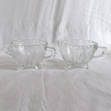 Load image into Gallery viewer, Bubbles and darts adorn this adorable "Burple-Inspiration-Clear" pressed glass art deco style creamer and sugar set. Crafted by Anchor Hocking, USA, circa 1930s. A Great addition to your tableware. Love the tiny feet too! In excellent condition, no chips or cracks.