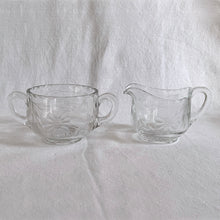 Load image into Gallery viewer, Vintage WJ Hughes cut Corn Flower glass creamer and sugar bowl. Crafted by Tiffin Glass blanks (Tiffin #036), USA, 1930s. The perfect addition to any elegant glassware collection and tea/coffee service at your next dining event. Makes a lovely hostess or housewarming gift.
In excellent condition, no chips.