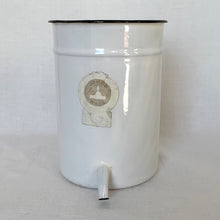 Load image into Gallery viewer, Vintage white and black rimmed enameled metal irrigator with spout. Crafted by Jones Metal Products Company, USA, 1950s. This handy vessel has a hole on the back for easy hanging which makes it perfect for storing kitchen utensils, paint brushes, garden tools or use as a garden planter.
In vintage condition. Original Jones Ware label.
Measures 5 1/4 x 7 1/4 inches