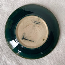 Load image into Gallery viewer, Vintage slip glazed and hand painted "African Lily' art pottery pin dish in tones of teal, green, burgundy and blue. Designed by Walter Moorcroft and produced by Moorcroft Pottery, England, circa 1950 In excellent condition, free from chips/cracks/repairs, crazing present. Impressed with "Moorcroft" and "Made in England". Measures 4-1/2" x 3/4"