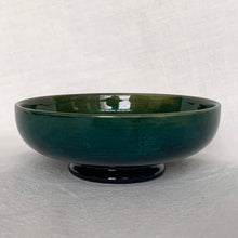 Load image into Gallery viewer, Vintage hand painted "Anemone" footed bowl on a deep green ground with shades of blue and red. In excellent condition, free from chips, cracks, repairs, crazing present. Paper label with Royal Warrant and "Potters to the late Queen Mary". Size: 4-1/2" x 1-1/2"