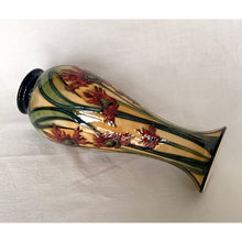 Load image into Gallery viewer, Vintage hand painted Ragged Poppy limited edition art pottery vase, number 113/350. Designed by Nicole Slaney in 2003. This piece is hand painted over slip glaze with a deep blue ground in shades of yellow, green and red on shape 75/10. Produced by Moorcroft Pottery, Stoke-on-Trent England. Excellent condition, no chips, cracks or repairs. First quality. Maker's marks, edition and signed by the artist on the bottom, see photos. Measures 4-1/2" x 11"