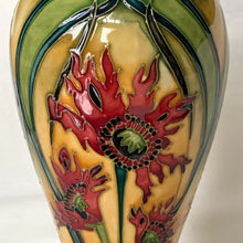 Load image into Gallery viewer, Vintage hand painted Ragged Poppy limited edition art pottery vase, number 113/350. Designed by Nicole Slaney in 2003. This piece is hand painted over slip glaze with a deep blue ground in shades of yellow, green and red on shape 75/10. Produced by Moorcroft Pottery, Stoke-on-Trent England. Excellent condition, no chips, cracks or repairs. First quality. Maker's marks, edition and signed by the artist on the bottom, see photos. Measures 4-1/2" x 11"