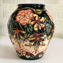 Load image into Gallery viewer, Vintage hand painted "Oberon" vase. Designed by Rachel Bishop in 1993. Hand painted on raised slip technique on ceramic mold, shape 4/10. Produced by Moorcroft Pottery, 1993.  In excellent condition free from chips, cracks, repairs. A first quality piece, purchased at Moorcroft Pottery shop in Stoke-on-Trent, England, offered from our personal collection. See photo for maker's marks on bottom of vase. Original box.  Measures 7-1/2" x 8-1/4"