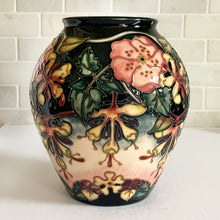 Load image into Gallery viewer, Vintage hand painted "Oberon" vase. Designed by Rachel Bishop in 1993. Hand painted on raised slip technique on ceramic mold, shape 4/10. Produced by Moorcroft Pottery, 1993.  In excellent condition free from chips, cracks, repairs. A first quality piece, purchased at Moorcroft Pottery shop in Stoke-on-Trent, England, offered from our personal collection. See photo for maker's marks on bottom of vase. Original box.  Measures 7-1/2" x 8-1/4"