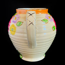 Load image into Gallery viewer, Vintage Art Deco horizontal ribbed beehive handled pitcher, No. 1881E, featuring hand painted florals in shades of pink, purple, green, yellow and orange on a butter yellow ground with gold gilt details. Crafted by Kensington Ware, England, 1940s. A lovely piece to add to your tableware and home decor!
In excellent vintage condition, no chips/cracks/repairs, typical age-related crazing. Maker's marks.
Measures 7 1/2 x 8 1/2 x 8 inches