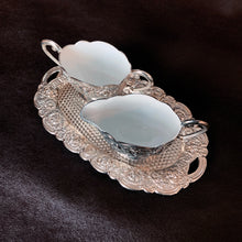 Load image into Gallery viewer, Vintage silver plate creamer, sugar and tray set features the prettiest embossed floral details and a smooth white enamel interior. Crafted by Himark, Japan, 1960s. Add some charm and shine to your tablescape!
In excellent condition.
Measurements
Tray 8 x 4 1/2 inches
Sugar Bowl 4 1/2 x 2 3/4 inches (incl. handles)
Creamer 4 x 2 3/4 inches (incl. handle)