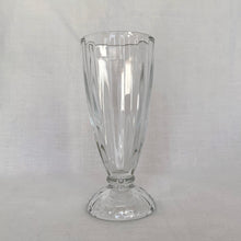 Load image into Gallery viewer, Vintage clear 5110 fluted footed soda fountain glass. Libbey Glass, began making this pattern in the 1950s. Brings back great memories of sipping on creamy milkshakes and floats at the local drugstore. A classic that is always in style!
In excellent condition, no chips.
Measures 3 1/4 x 7 1/2 inches tall
Capacity 12 ounces