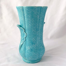 Load image into Gallery viewer, A lovely vintage art deco sky blue and white speckled feminine fluted vase with leaf handles. Crafted by Shorter & Son, England, 1940s. A beautiful vase to use as a decor piece or fill it with a beautiful bouquet of flowers!
In good vintage condition, two flea bites on the rim which aren't too noticeable thanks to the white speckled glaze. No cracks or repairs. Maker's marks.
Measures 5 x 8 3/4 inches