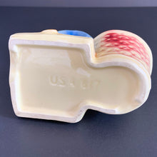 Load image into Gallery viewer, Vintage Chinoiserie style highly detailed ceramic planter featuring an Asian gentleman with umbrella alongside a basket shades of beige, blue and red. Crafted by Shawnee Pottery, USA, 1940s. Perfect for a succulent.
In excellent condition, no chips/cracks.
Measures 5 x 3 1/4 x 5 1/4 inches