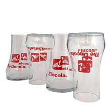 Load image into Gallery viewer, Vintage set of four, 7Up bilingual upside down drinking glasses with the 7Up logo in red along with their classic tagline, &quot;The Uncola&quot; in English and &quot;L&#39;encola&quot; in French. The glass come in the original cardboard tube with 7Up logo and red plastic end caps. Crafted by Libbey Glass, Canada, circa 1970s. A great addition to promotional advertising and glassware collections!  Glasses are in excellent condition, never used, no chips/wear. The tube has water damage, but still sturdy. Each glass is marked with t
