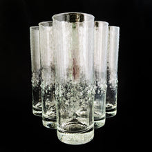 Load image into Gallery viewer, This &quot;Alaska&quot; Tom Collins cocktail highball features a textured rain pattern with pronounced drops 2/3rds of the way from the top of the glass. Crafted by Durobor of Belgium, circa 1960s. Similar to the Scandinavian glassware of the mid 20th century it is often mistaken for Iittala&#39;s &quot;Mesi&quot; glassware. This beautiful glass is ideal for cocktail making or cold beverages.  In excellent condition, free from chips.  Measures 2 1/4 x 6 3/4 inches  Priced individually. We have 7 in stock.
