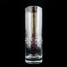 Load image into Gallery viewer, This &quot;Alaska&quot; Tom Collins cocktail highball features a textured rain pattern with pronounced drops 2/3rds of the way from the top of the glass. Crafted by Durobor of Belgium, circa 1960s. Similar to the Scandinavian glassware of the mid 20th century it is often mistaken for Iittala&#39;s &quot;Mesi&quot; glassware. This beautiful glass is ideal for cocktail making or cold beverages.  In excellent condition, free from chips.  Measures 2 1/4 x 6 3/4 inches  Priced individually. We have 7 in stock.
