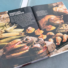 Load image into Gallery viewer, Better Homes and Gardens is known for its fabulous cookbooks. This hardcover cookbook focuses on their all time favourite barbecue inspired recipes. Its 96 pages are filled with amazing  recipes along with many colour photographs. Originally published by Meredith Corporation, USA, 1977. This is the fourth printing 1984.   In great vintage condition with normal age-related yellowing.
