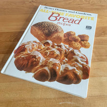 Load image into Gallery viewer, Better Homes and Gardens is known for its fabulous cookbooks. This hardcover cookbook focuses on All-Time Favourite Bread Recipes. Its 96 pages are filled with amazing  recipes along with many colour photographs. Originally published by Meredith Corporation, USA, 1979. This is the fourth printing, 1985.   In great vintage condition with normal age-related yellowing.

