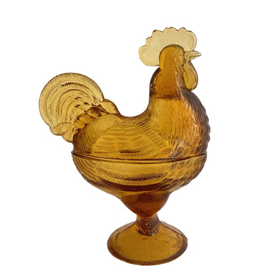 Vintage amber pressed glass standing rooster lidded candy dish #208. Crafted by Smith Glass, USA, 1907 - 2010. A fun piece to store treats, or use as farmhouse or cottage decor.  In used vintage condition. There is roughness on the rims, but they could be from rough mold release, or they are flea bites.  Measures 6 1/2 x 4 x 8 1/2 inches