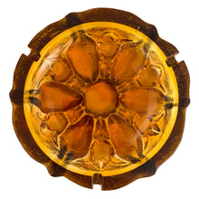 Load image into Gallery viewer, This vintage mid-century art glass amber ashtray features a textured outer surface and sunflower design. Circa 1960s. Possibly made using a sand cast mold process.  In excellent condition, free from chips.  Measures 7 1/2 x 2 3/4 inches
