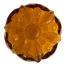 Load image into Gallery viewer, This vintage mid-century art glass amber ashtray features a textured outer surface and sunflower design. Circa 1960s. Possibly made using a sand cast mold process.  In excellent condition, free from chips.  Measures 7 1/2 x 2 3/4 inches
