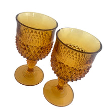 Load image into Gallery viewer, Angled view of Indiana Glass Diamond Point amber water goblets showing all-over diamond pattern
