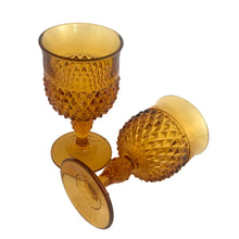 Load image into Gallery viewer, Close-up of diamond point pattern on vintage Indiana Glass amber goblet, warm honey amber colour
