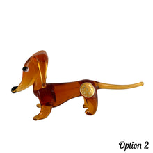 Load image into Gallery viewer, Sweet vintage hand blown amber glass Daschund puppy dog lamp flame work figurine. Crafted in Murano, Italy. A great piece to begin or add to your Murano Glass collection!  In excellent condition, free from chips. Original sticker.  Measures 4 x 1 1/8 x 2 inches
