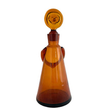 Load image into Gallery viewer, Detail of hand-blown amber glass and applied arms on Boda People decanter
