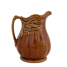Load image into Gallery viewer, Vintage amber glazed ironstone creamer pitcher featuring a wheat motif. Crafted by Arthur Wood. England. 1950s. Perfect to use as intended or as part of your farmhouse, country and cottagecore decor.

Excellent condition, no chips/cracks/repairs. Crazing present. Marked on the bottom.

Measures 4 2 5/8 x 4 5/8 inches
