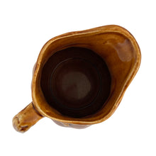 Load image into Gallery viewer, Vintage amber glazed ironstone creamer pitcher featuring a wheat motif. Crafted by Arthur Wood. England. 1950s. Perfect to use as intended or as part of your farmhouse, country and cottagecore decor.

Excellent condition, no chips/cracks/repairs. Crazing present. Marked on the bottom.

Measures 4 2 5/8 x 4 5/8 inches
