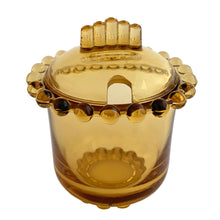 Load image into Gallery viewer, Vintage amber Party Line lidded glass marmalade jar or sugar bowl with a distinctive beaded edge. Crafted by Paden City Glass, USA, 1950s. A lovely addition to your tableware collection, or to give as a gift with a jar of your favourite condiment.

In very good condition, no chips, minor flea bites at the spoon hole.

Jar measures 3 1/2 x 3 3/4 inches

