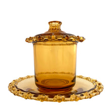 Load image into Gallery viewer, Vintage amber glass lidded marmalade jar and matching underplate both with elegant berry lace edge. Crafted by Rudolfova Glass, Czechoslovakia, 1950s. An lovely addition to your tableware collection, or to give as a gift with a jar of jam, marmalade or honey.

In very good condition, no chips, minor flea bites at the spoon hole.

Jar measures 3 1/2 x 4 inches, underplate 5 1/2 inches
