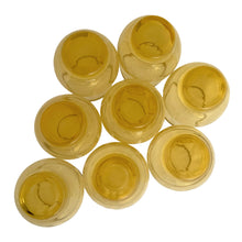 Load image into Gallery viewer, Bottom view of 8 vintage amber Libbey Tempo juice glasses showing ribbed bases and golden amber glass
