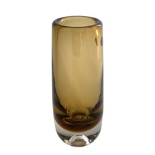 Load image into Gallery viewer, Vintage modernist amber glass vase featuring a clear base with bubble. Crafted by Magnor Glassverk, Norway, 1960s. A stunning piece of art glass to elevate your home's decor.

In excellent condition, no chips. Original tag.

Measures 2 3/4 x 7 1/8 inches

