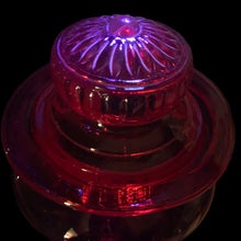 Load image into Gallery viewer, Striking amberina hand blown vintage apothecary canister jar with ground lid which is topped with an embossed flower. Takahashi Glass, Japan, circa 1970. This fabulous colour will liven up any room and it glows under black light! In good vintage condition. There is chipping chips to the inside rim of the lid see photos. There are bubbles in the glass typical of the manufacturing process. Measures 6 3/4 x 10 inches
