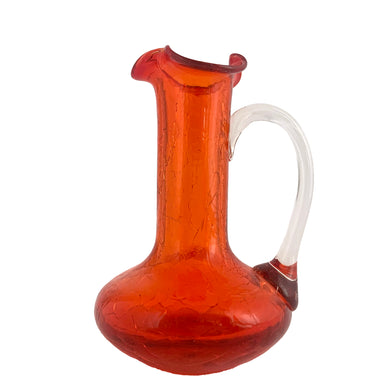 Vintage miniature hand blown amberina crackle art glass pitcher with clear applied handle. Crafted by Pilgrim Glass, circa 1960s. A great piece to start or add to your art glass collection!

In excellent condition, free from chips/cracks/repairs.

Measures 2 3/4 x 4 3/8 inches