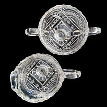 Load image into Gallery viewer, Elegant vintage American Brilliant Cut Glass Eleanor creamer and double handled open sugar. Crafted in the USA, early 20th century. These beauties are cut with an infinity pattern of diamond and cut leaves, crimped rims and sawtooth cut bottoms. Adds a touch of old world elegance to any tablescape.

In excellent condition, no chips.

Creamer measures 3 x 4 1/2 x 5 inches

Sugar measures 5 1/2 x 3 1/2 x 4 inches

