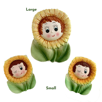 Set of three vintage mid-century era, hand painted anthropomorphic sunflower face ceramic wall pockets. Crafted by PY, Japan, 1950s.  A must-have for any home decor collector, this charming and highly sought-after set is sure to add a touch of kitschy cuteness to your space.


In good vintage condition with minor wear to the top of the sunflowers and rim and a tiny chip on the large one, see photos.

Large measures 5 x 1 3/4 x 7 inches

Two small measures 3 1/2 x 1 3/8 x 4 3/4 inches