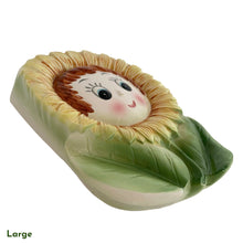 Load image into Gallery viewer, This vintage ceramic wall pocket features a mid-century anthropomorphic hand painted sunflower face, crafted by PY, Japan, 1950s. A must-have for any home decor collector, this charming and highly sought-after piece is sure to add a touch of kitschy cuteness to your space.
In good vintage condition with minor wear to the top of the sunflowers and rim and a small chip on the large one, see photos.

Large measures 5 x 1 3/4 x 7 inches

Small measures 3 1/2 x 1 3/8 x 4 3/4 inches

