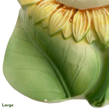 Load image into Gallery viewer, This vintage ceramic wall pocket features a mid-century anthropomorphic hand painted sunflower face, crafted by PY, Japan, 1950s. A must-have for any home decor collector, this charming and highly sought-after piece is sure to add a touch of kitschy cuteness to your space.
In good vintage condition with minor wear to the top of the sunflowers and rim and a small chip on the large one, see photos.

Large measures 5 x 1 3/4 x 7 inches

Small measures 3 1/2 x 1 3/8 x 4 3/4 inches
