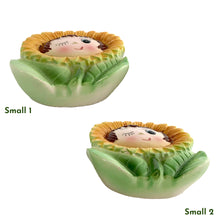 Load image into Gallery viewer, This vintage ceramic wall pocket features a mid-century anthropomorphic hand painted sunflower face, crafted by PY, Japan, 1950s. A must-have for any home decor collector, this charming and highly sought-after piece is sure to add a touch of kitschy cuteness to your space.In good vintage condition with minor wear to the top of the sunflowers and rim and a small chip on the large one, see photos.

Large measures 5 x 1 3/4 x 7 inches

Small measures 3 1/2 x 1 3/8 x 4 3/4 inches
