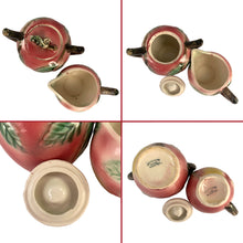 Load image into Gallery viewer, Rare Find! Sweet vintage mid-century era majolica style figural apple shaped ceramics, including a teapot, creamer and covered sugar featuring brown branch handles and green leaves. Crafted by Metroware, Japan, circa 1940s. Perfect to add kitsch style to your kitchen decor. In excellent used vintage condition, free from chips, with interior staining and crazing. Measures 8 1/2 x 4 3/4 x 5 3/4 inches
