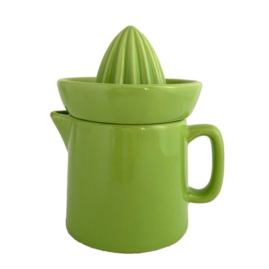 Vintage apple green glazed ceramic citrus reamer and pitcher. In excellent condition, free from chips/cracks/repairs. Overall measures 4 1/8 x 6 1/2 inches