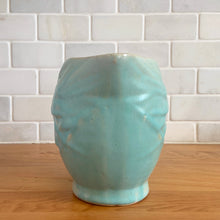 Load image into Gallery viewer, Vintage matte aqua glazed Bird in Berries pitcher. Crafted by McCoy Pottery, USA, 1935. This rare and highly collectible pitcher is the perfect for flowers or decorative display and makes a lovely gift for an art pottery collector.

In excellent vintage condition, no chips,cracks or repairs, manufacturer&#39;s glaze pops. Unmarked.

Measures 4 x 5 3/4 x 4 7/8 inches (incl. handle/spout)
