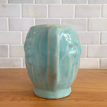Load image into Gallery viewer, Vintage matte aqua glazed Bird in Berries pitcher. Crafted by McCoy Pottery, USA, 1935. This rare and highly collectible pitcher is the perfect for flowers or decorative display and makes a lovely gift for an art pottery collector.

In excellent vintage condition, no chips,cracks or repairs, manufacturer&#39;s glaze pops. Unmarked.

Measures 4 x 5 3/4 x 4 7/8 inches (incl. handle/spout)
