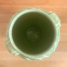 Load image into Gallery viewer, Vintage mid-century gloss aqua handled vase with embossed leaves. Crafted by McCoy Pottery, 1948. This lovely vase is must for any art pottery collector!

In excellent condition, no chips/cracks/repairs, crazing commensurate with age and manufacturing glaze pops. Maker&#39;s mark on the bottom.

Measures 5 1/2 x 8 inches
