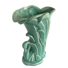 Load image into Gallery viewer, Beautiful vintage Swan vase glazed in gloss aqua, features a swan swimming in the reeds. Crafted by McCoy Pottery, 1948. This vase is must for any art pottery collector!

In excellent vintage condition, no chips, no cracks, no repairs. Minor manufacturer's defects, see photos. Maker's mark on the bottom.

Measures 6 7/8 x 4 1/8 x 9 1/4 inches
