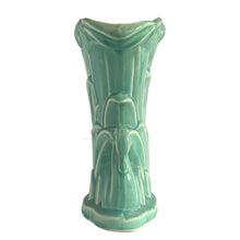Load image into Gallery viewer, Beautiful vintage Swan vase glazed in gloss aqua, features a swan swimming in the reeds. Crafted by McCoy Pottery, 1948. This vase is must for any art pottery collector!

In excellent vintage condition, no chips, no cracks, no repairs. Minor manufacturer's defects, see photos. Maker's mark on the bottom.

Measures 6 7/8 x 4 1/8 x 9 1/4 inches
