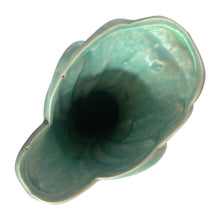 Load image into Gallery viewer, Beautiful vintage Swan vase glazed in gloss aqua, features a swan swimming in the reeds. Crafted by McCoy Pottery, 1948. This vase is must for any art pottery collector!

In excellent vintage condition, no chips, no cracks, no repairs. Minor manufacturer's defects, see photos. Maker's mark on the bottom.

Measures 6 7/8 x 4 1/8 x 9 1/4 inches
