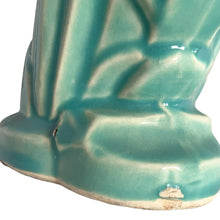 Load image into Gallery viewer, Beautiful vintage Swan vase glazed in gloss aqua, features a swan swimming in the reeds. Crafted by McCoy Pottery, 1948. This vase is must for any art pottery collector!

In excellent vintage condition, no chips, no cracks, no repairs. Minor manufacturer's defects, see photos. Maker's mark on the bottom.

Measures 6 7/8 x 4 1/8 x 9 1/4 inches

