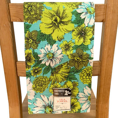 Lovely shabby chic or farmhouse style vintage hand printed natural linen tea towel featuring florals in aqua, cream, shades of green and black. An artful addition to your vintage or contemporary kitchen decor.

In excellent condition, new old stock. Made in Hungary. Original paper label.

Measures 17 x 29 inches