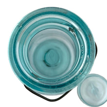 Load image into Gallery viewer, Vintage Perfect Seal aqua glass mason jar,featuring glass lid and wire bail closure. Produced by the Hamilton Glass Works in the early 20th century. These jars are fabulous for storing dry goods or may be repurposed as a vase. Perfect for farmhouse and cottage core decor.  In as found condition.  Measures 4 1/2 x 9 1/2 inches  Capacity 2 quarts (1/2 gallon)
